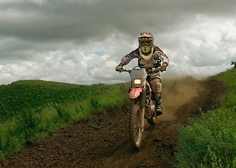 man on trail bike at speed